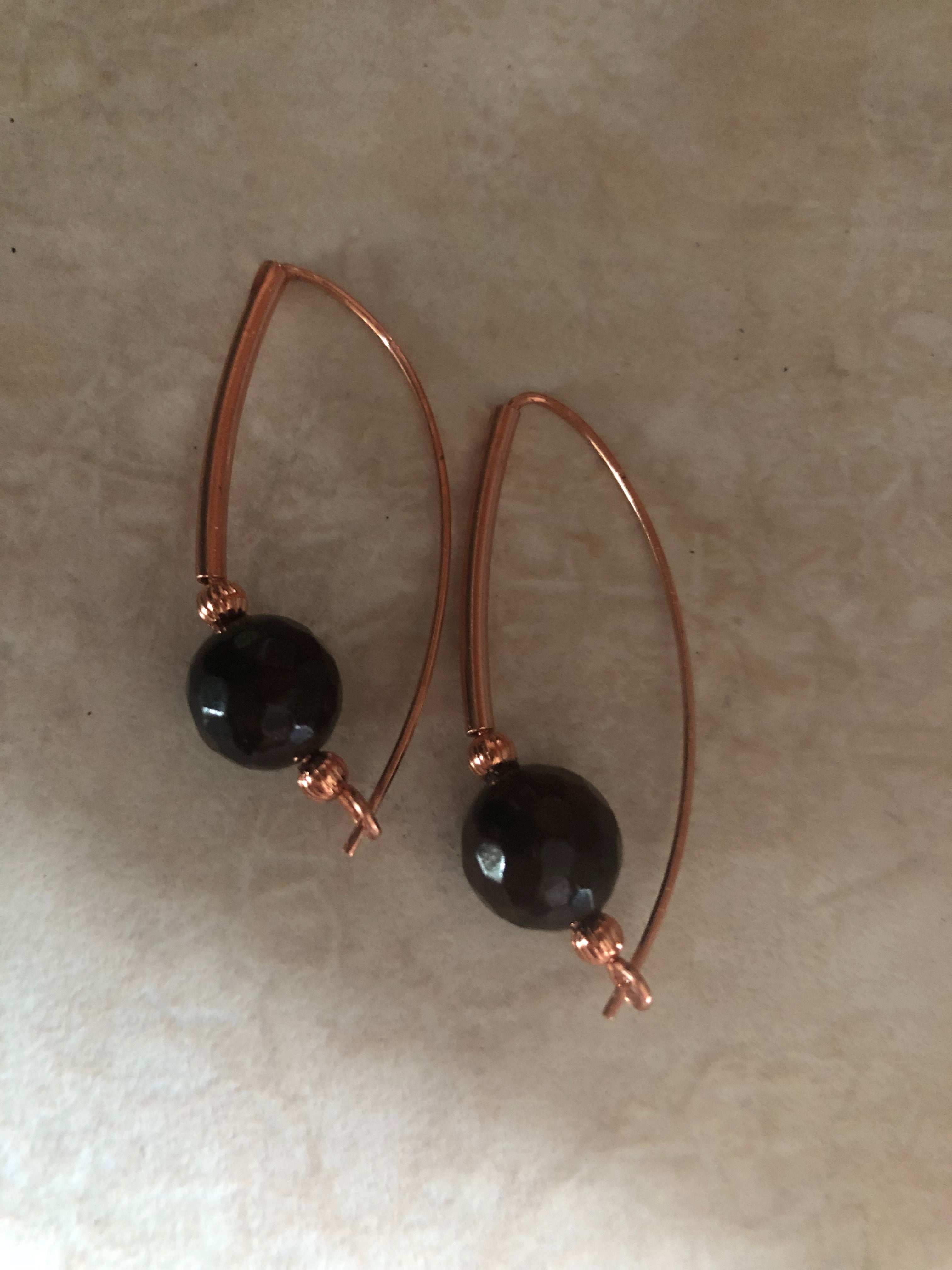 E145 Copper and 10mm Garnet “Around the Bend” earrings